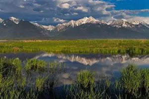 Chuck Haney Prints: Wetlands pond reflects the Mission Mountains at sunset at Ninepipe National Wildlife Refuge near Ronan
