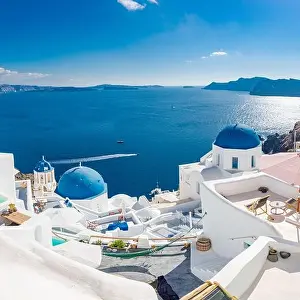 White architecture of Oia village on Santorini island, Greece. Amazing sea view, summer vacation landscape. Luxury travel destination, famous landmark
