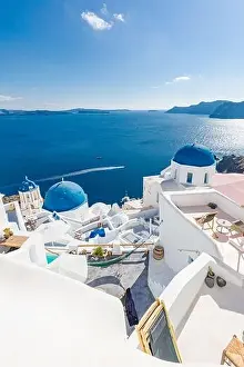 White architecture of Oia village on Santorini island, Greece. Amazing sea view, summer vacation landscape. Luxury travel destination, famous landmark