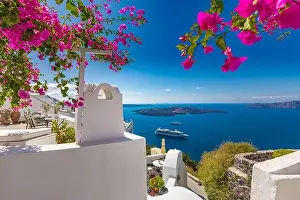 White architecture on Santorini island, Greece. Beautiful luxury landscape with sea view over flowers. Amazing, summer travel vacation destination