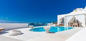 White architecture on Santorini island, Greece. Swimming pool in luxury hotel. Beautiful view on the sea, summer vacation, travel destination stunning