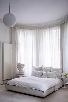 Duvet Prints: White bedroom with modern art sculpture in West London apartment, UK