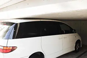 Kobe Prints: A white car parked with great precision