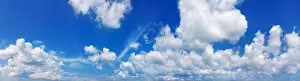 Cumulus Prints: White cumulus clouds on clear blue sky background panorama