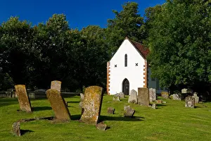 West Midlands Prints: The white painted church and graveyard in the village of Alveston in Warwickshire England UK