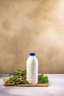 Dairy Product Prints: White plastic bottle of milk or yogurt with blue cap