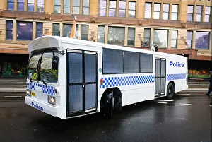 Armored Prints: White police bus, converted for the mass transport of people who have been arrested