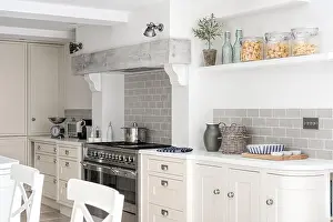 Saucepan Prints: Whitewashed beam above range cooker in spacious kitchen