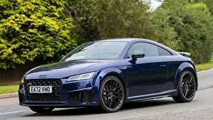 Motoring Prints: Whittlebury, Northants, UK -Aug 26th 2023: 2022 blue Audi TT car travelling on an English country road