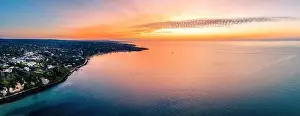 Travel Locations Prints: Wide aerial panorama of beautiful sunset glowing over calm bay waters and scenic coastline of Mornington Peninsula