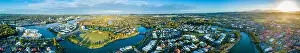 Gold Coast Prints: Wide aerial panorama of beautiful sunset over luxury suburb on the Gold Coast