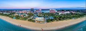Wide aerial panorama of Frankston foreshore with the Waves restaurant and South East Water head office building at dusk