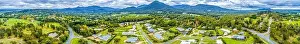 Rural Town Prints: Wide aerial panorama of scenic countryside with houses surrounded by forest and mountains