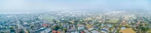 Bushfire Prints: Wide aerial panorama of suburbs covered in smoke haze from bush fires in Gippsland