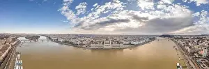 Morning Glow Prints: Wide angle aerial drone shot of Hungarian Parliament with clouds in Budapest Winter morning