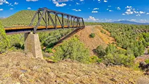 Metal Bridge Prints: Wide angle photo of an old railroad trestle bridge spanning Bear Canyon near Perkinsville Arizona in the Prescott