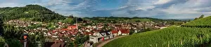 Wide hires panoramic landscape view of green valley in Schwartzwald. Green hills with vineyards and old medieval castle