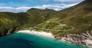 Winding clifftop road leads to picturesque Keem Bay and beach on Achill Island in County Mayo in western Ireland