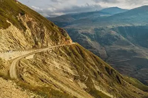 Serpentine Road Prints: Winding road in the Dagestan Mountains with big mountain formation in the background