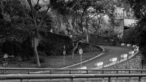 Scenic Beauty Prints: A winding road surrounded by trees and stone walls