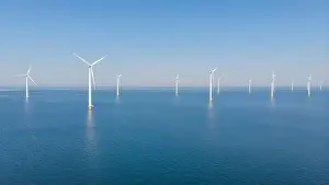 Turbines Prints: Windmill turbines at sea generate green energy in the Netherlands Drone view