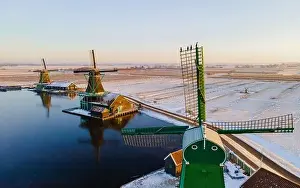 Cold Weather Prints: Windmill village Zaanse Schans during winter with snow landscape in the Netherlands Holland village in winter