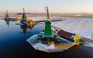 Cold Weather Prints: Windmill village Zaanse Schans during winter with snow landscape in the Netherlands Holland village in winter