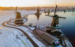 Cold Weather Prints: Windmill village Zaanse Schans during winter with snow landscape in the Netherlands Holland village in winter