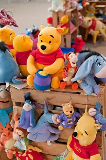 Dolls Prints: Winnie the Pooh toys for sale at a local market
