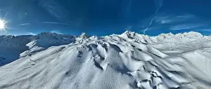 Pistes Prints: Winter drone shot of ski pistes and slopes covered with fresh powder snow in Tignes in Valdisere France