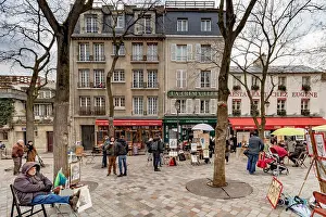 Montmartre Prints: Winter in Paris artists sitting in The Place Du Tertre
