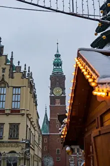 Icicle Prints: Winter street in Wroclaw shows the Old Town Hall clock tower on Rynek