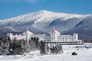 Hotels Prints: Winter view of the facade of the majestic Mount Washington Hotel located at the base of the White Mountains in Bretton
