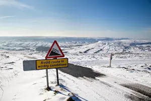 Conditions Prints: Wintry Warning Sign, Steep Road down into Farndale from Blakey Ridge