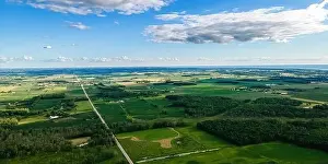 Wisconsin farmlands and roads with Lake Winnebago shore in the far distance