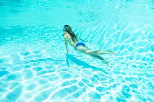 Weekend Activities Prints: Woman in bikini swimming in pool