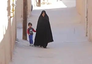 Walks Prints: Woman in chador with child