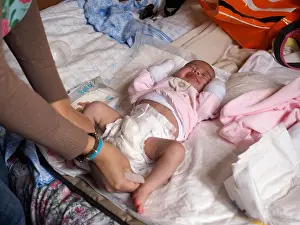 Diaper Prints: Woman changing baby diaper