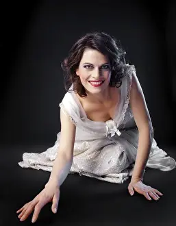 Kneeling Prints: Woman crawling in a light-coloured dress