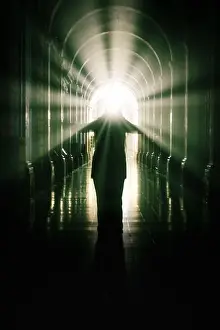 Nightmare Prints: woman in a cross-coat. Rays of light coming out of the head