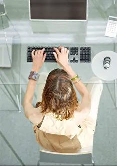 Concentrate Prints: Woman at desk working on computer, elevated view