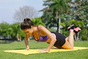 Knee Prints: Woman doing knee push-ups exercise in the park