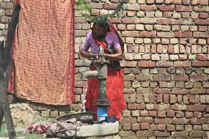 Villager Prints: Woman drawing water from a water pump, India