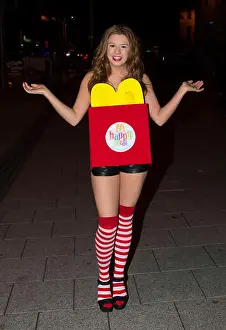 Fancy Dress Costume Prints: A woman dressed as a McDonalds happy meal on halloween in Cardiff, Wales, UK