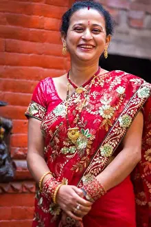 Grownups Prints: Woman dressed in a red traditional indian dress for a wedding in Nepal