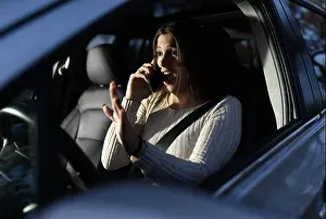 Shocked Prints: A woman driving car and having call on phone