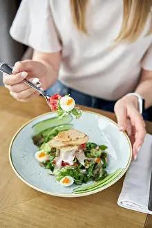 Potatoes Prints: Woman eats Olivier salad with Lamb tongue