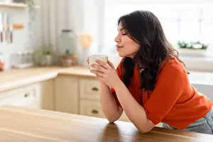 Middle Eastern Prints: Woman enjoying a coffee break at home