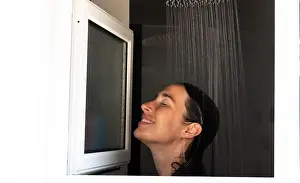 Self Care Prints: Woman enjoying refreshing shower in modern bathroom with closed eyes