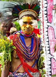 Papua New Guinea Prints: Woman with her face painted and wearing traditional tribal costume at the singsing Goroka Festival